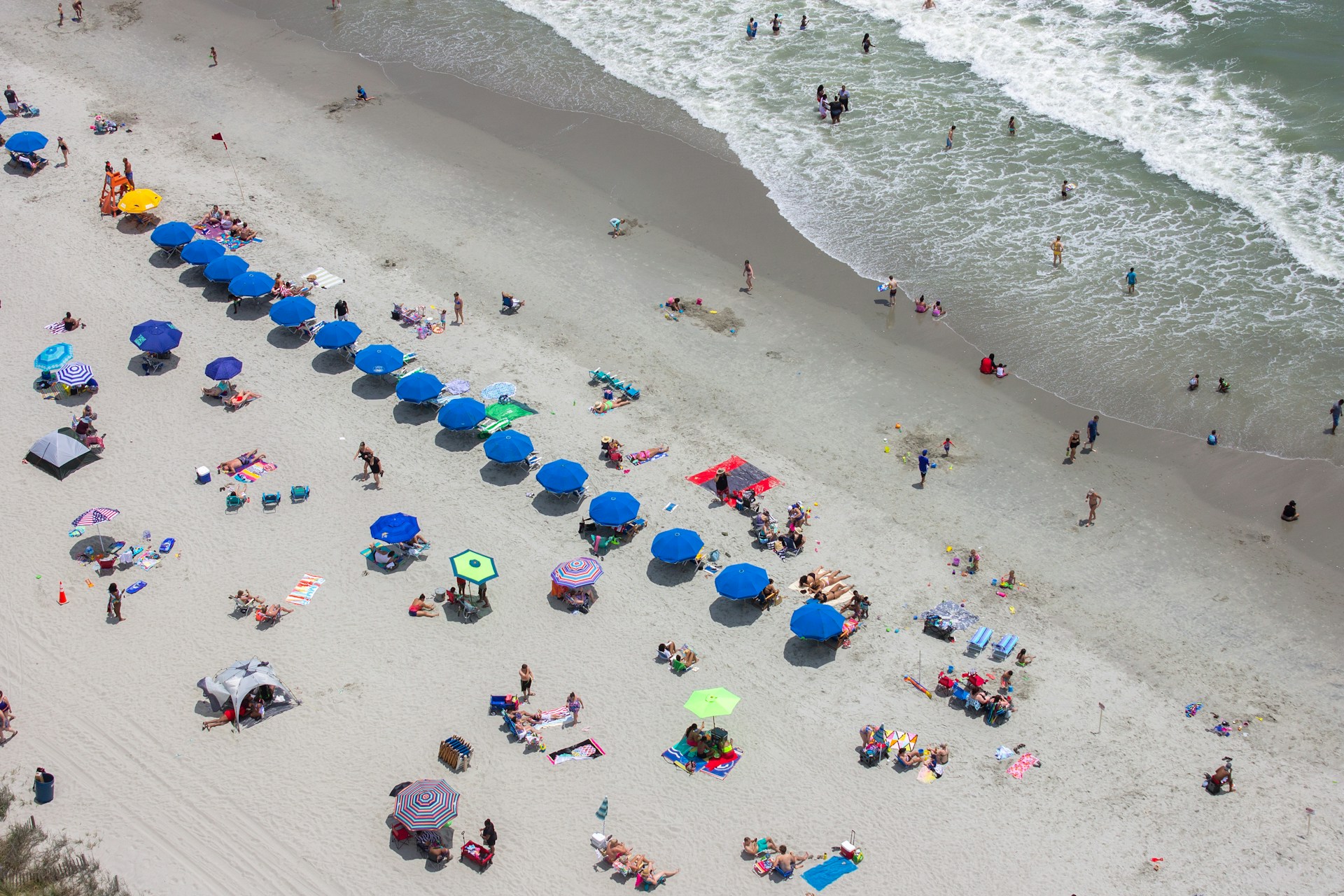 People and umbrellas on beach